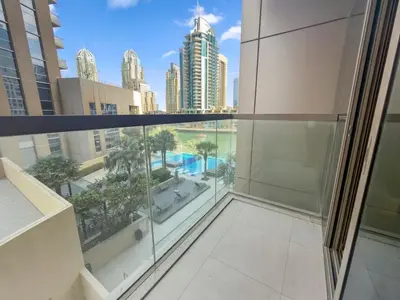 a balcony with a view of a city at Stylish Deluxe Two Bedrooms In Dubai Marina in Dubai
