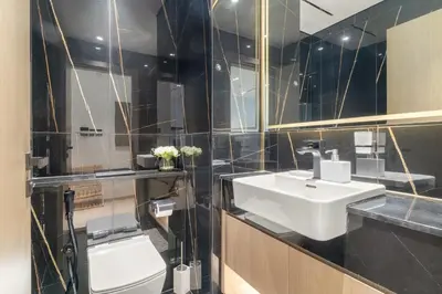 a bathroom with a sink and a toilet at Elegant 1BR Living at Binghatti Emerald in Dubai