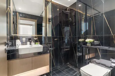 a bathroom with a sink and a toilet at Elegant 1BR Living at Binghatti Emerald in Dubai