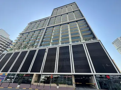 a tall building with a lot of windows at Elegant 1BR Living at Binghatti Emerald in Dubai