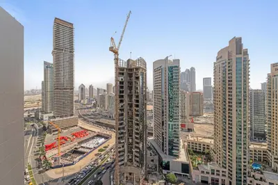a view of a city with tall buildings at Silkhaus Luxurious 1BR with Balcony Pool and Gym Downtown in Dubai