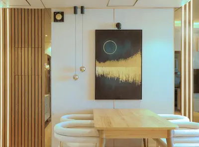 a dining room with a wooden table and stools at 902, Royal Residencies, Dubai Sports City in Dubai