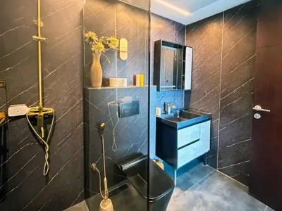 a bathroom with a sink and a shower at 902, Royal Residencies, Dubai Sports City in Dubai