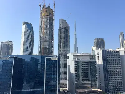 a group of tall buildings in a city at Burj Khalifa View Stylish 1BR in Business Bay in Dubai
