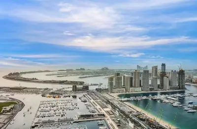 a view of a city with boats in the water at 1BR 42nd Floor Palm Jumeriah & Sea View- 5 Sleeps in Dubai