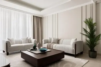 a living room with two couches and a coffee table at Beachfront 1BR with Private Beach Access Renovated in Dubai