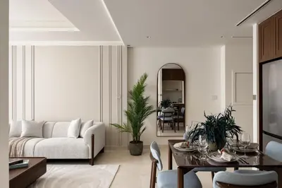 a living room with a couch and a table at Beachfront 1BR with Private Beach Access Renovated in Dubai