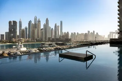 a view of a city skyline from a body of water at Beachfront 1BR with Private Beach Access Renovated in Dubai