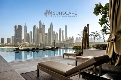 a view of a city skyline from a swimming pool at Beachfront 1BR with Private Beach Access and Balcony in Dubai
