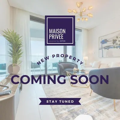 a new property coming soon sign in a living room at Maison Privee - Urban Living with Dubai Marina Skyline Views in Dubai