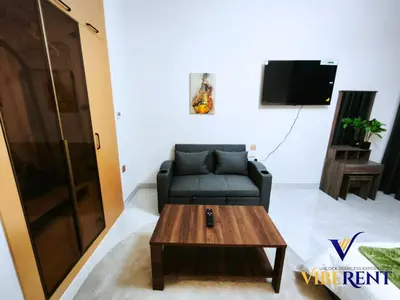 a living room with a couch and a coffee table at Skyz by Danube Studio Dubai in Dubai