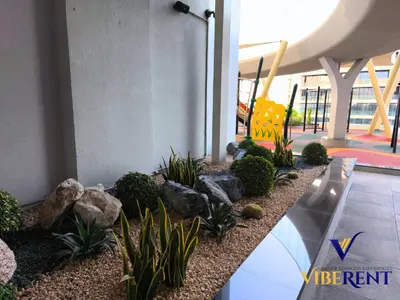 a garden in a building with rocks and plants at Skyz by Danube Studio Dubai in Dubai