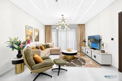 a living room with a couch and a table at Enchanted 1BR Royal Amwaj Burj View & Private Beach in Dubai