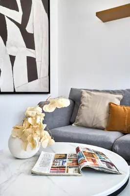 a living room with a couch and a coffee table at Frank Porter - Luma 21 in Dubai