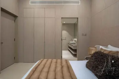 a bedroom with a bed and a bathroom at Sweet Escape 1BR in JVC Near Circle Mall in Dubai