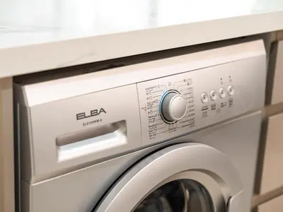 a white washer and dryer in a room at Stunning 2BR at Azizi Amber Sleeps 5 in Dubai