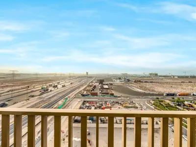 a view of a highway from a balcony at Stunning 2BR at Azizi Amber Sleeps 5 in Dubai