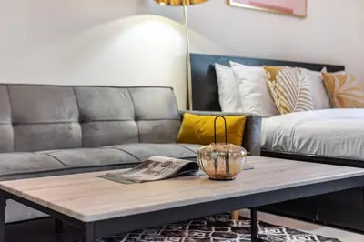 a living room with a couch and a coffee table at Classy Studio ideal for long stays with balcony in Dubai