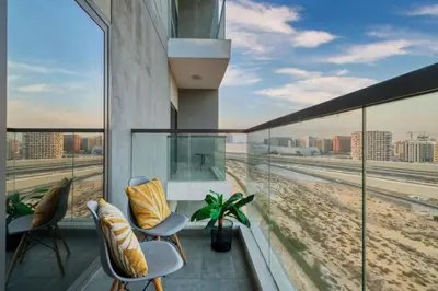 a balcony with chairs and a view of the beach at Studio in Liwan for long stays 1005 in Dubai