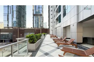 a row of chairs on a building with tall buildings at 77 Floor Luxury 1Br Marina Sea View Balcony in Dubai