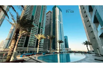 a view of a city with palm trees and buildings at 77 Floor Luxury 1Br Marina Sea View Balcony in Dubai