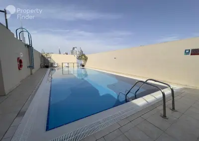 a swimming pool on the roof of a building at Large 1-bedroom by the canal, close to downtown in Dubai
