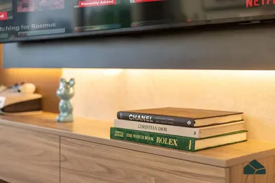a stack of books sitting on top of a table at Upgraded 1BR in JW Marriot with Marina View by BMS in Dubai