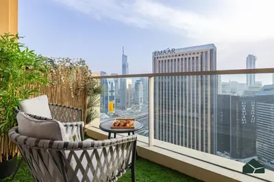 a balcony with a view of a city skyline at Upgraded 1BR in JW Marriot with Marina View by BMS in Dubai