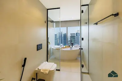 a bathroom with a tub and a sink and a shower at Upgraded 1BR in JW Marriot with Marina View by BMS in Dubai