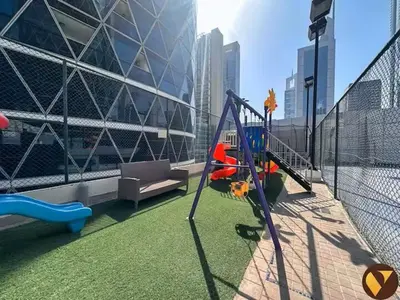 a playground on the balcony of a building at Vogue DIFC Damac Park Tower near Museum of The Future, One Bedroom Apartment with Balcony, City Skyline and Museum of The Future View, Access to all Amenities in Dubai