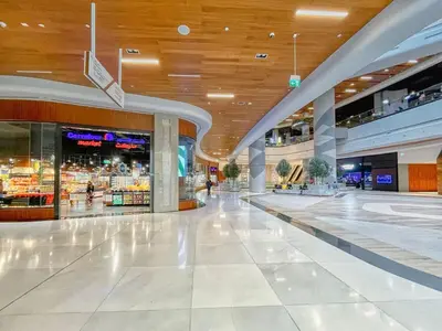 an empty shopping mall with a wooden ceiling at Vogue DIFC Damac Park Tower near Museum of The Future, One Bedroom Apartment with Balcony, City Skyline and Museum of The Future View, Access to all Amenities in Dubai