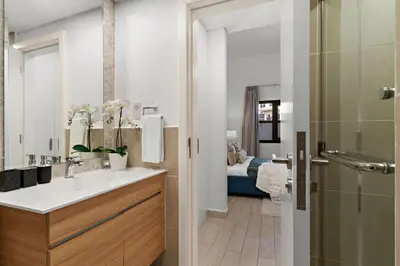 a bathroom with a sink and a shower at The Smart Concierge - Andalus Jumeirah Golf Estates in Dubai