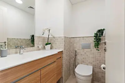 a bathroom with a sink and a toilet at The Smart Concierge - Andalus Jumeirah Golf Estates in Dubai