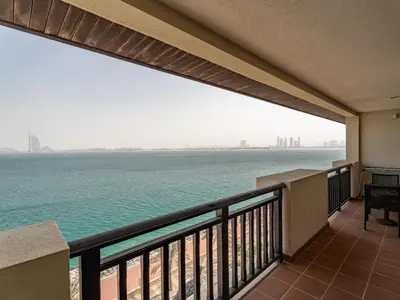 a balcony with a view of the ocean at Seaside Serenity 1BR Residence in Royal Amwaj in Dubai