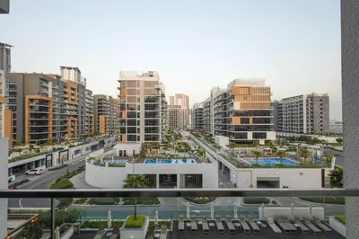a view of a city with tall buildings at Cozy 1BR with Pool & Gym l 15mn to Downtown in Dubai