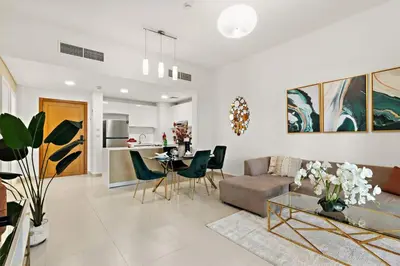 a living room with a couch and a table at The Smart Concierge - Andalus Jumeirah Golf Estates in Dubai
