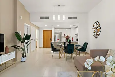 a living room with a couch and a table at The Smart Concierge - Andalus Jumeirah Golf Estates in Dubai