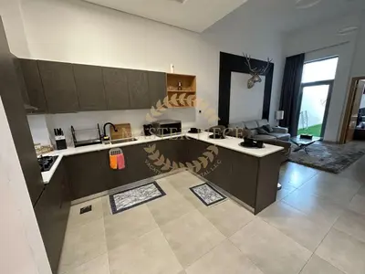 a large kitchen with a large island in a room at Pantheon Elysee in Dubai