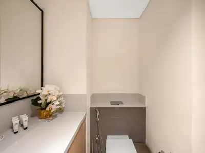 a bathroom with a sink and a mirror at Downtown 4BR Apartment for 12 Guests, Burj and Dubai Mall 5 min in Dubai
