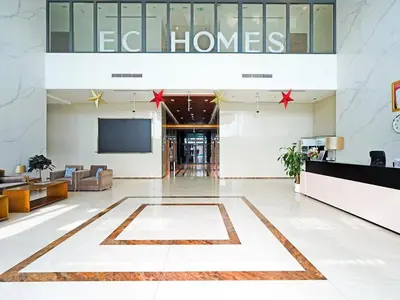 a lobby of an office building with a tv at Contemporary 1 Bedroom in the Heart of Al Furjan-205 in Dubai