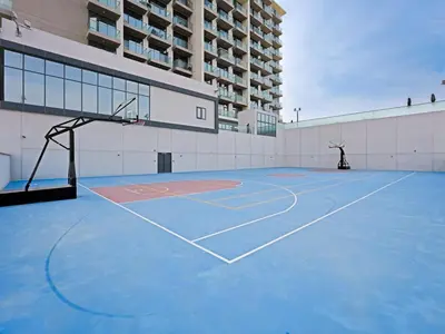 a basketball court in front of a building at Contemporary 1 Bedroom in the Heart of Al Furjan-205 in Dubai