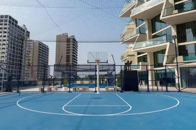 a basketball court in a city with a basketball hoop at Binghatti Royale Luxe 1BR W Private Pool Parking in Dubai