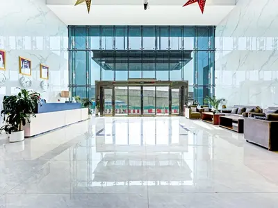 a lobby of a building with a large glass door at Exclusive 2BR Apartment - Prime Al Furjan-707 in Dubai