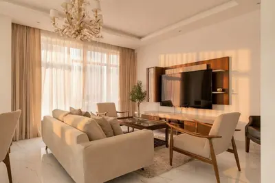 a living room with a couch and a table at 1 Bedroom Deluxe Apartment with Marina Views in Dubai