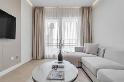a living room with a couch and a table at 2BR Retreat in the Heart of Dubai Marina by EE Holiday Homes in Dubai