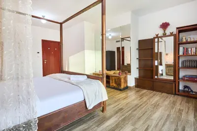 a bedroom with a bed and a large mirror at 3-Bedroom Residence in Murjan 5 - Jumeirah Beach with Sea Views in Dubai