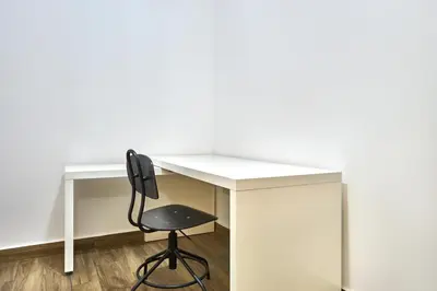 a white desk with a black chair next to it at 3-Bedroom Residence in Murjan 5 - Jumeirah Beach with Sea Views in Dubai