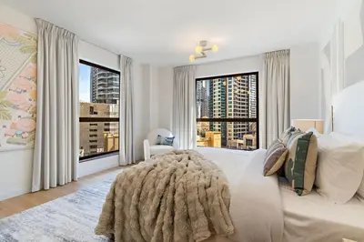 a bedroom with a large bed with a large window at The Smart Concierge - Murjan 5 in Dubai