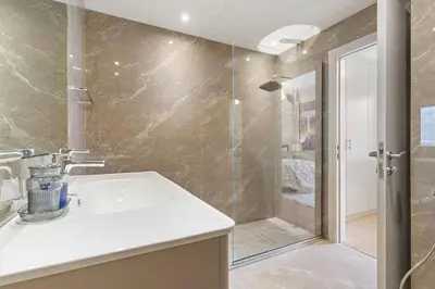a bathroom with a sink and a shower at The Smart Concierge - Murjan 5 in Dubai