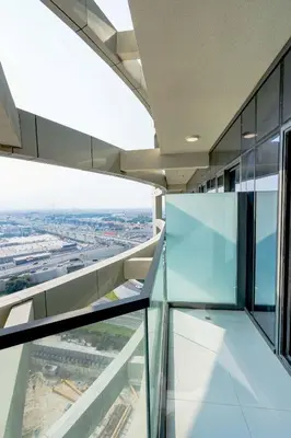 an office building with a view from the glass floor at Nasma Luxury stays- Lavish with luxury facilities in Aykon city in Dubai